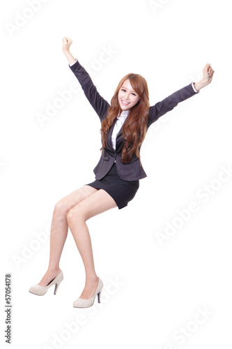 Happy business woman sitting