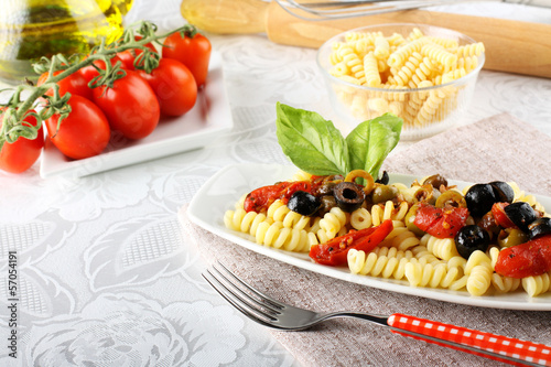 Pasta with olives, capers and tomatoes