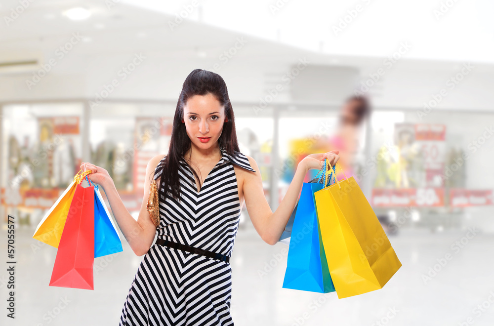 Young woman holding shopping bags Young woman holding shopping bags