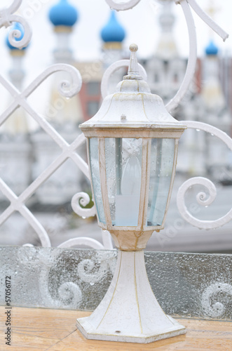 White outdoor lantern under the rain