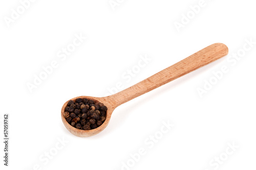 black pepper in wooden spoon