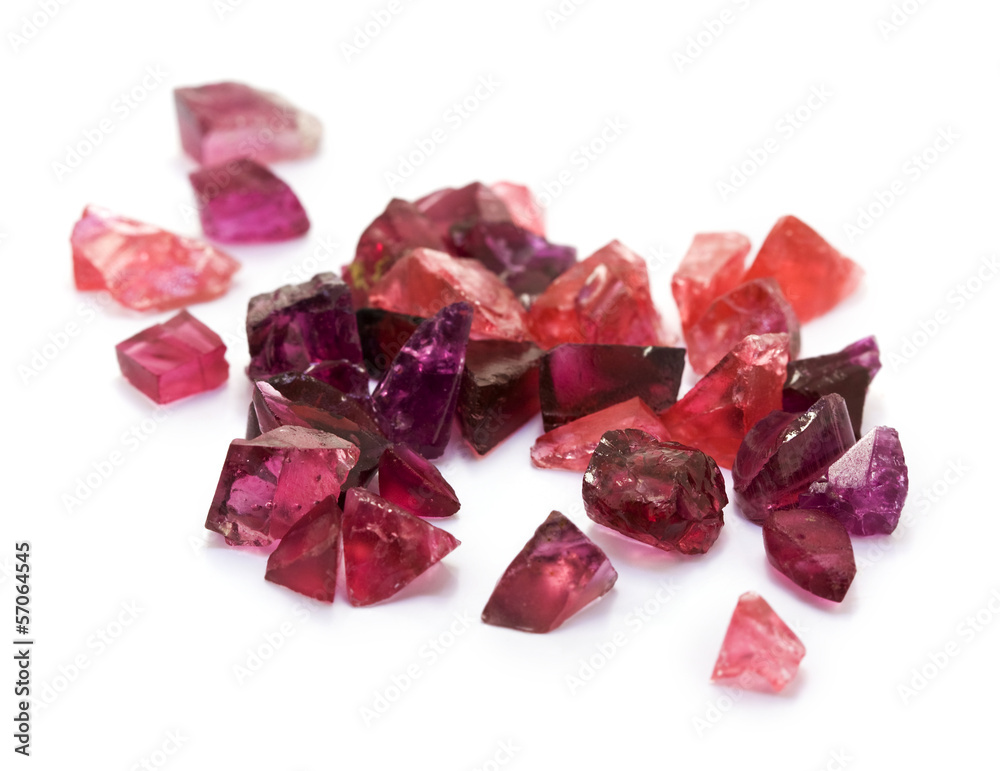 Raw uncut purple tourmaline gems on the white background. Raw uncut purple tourmaline gems on the white background.