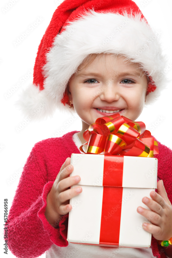 Happy girl with gift box near the Christmas tree. Happy girl with gift box near the Christmas tree.
