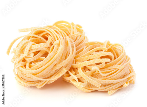 Italian pasta tagliatelle nest isolated on white background