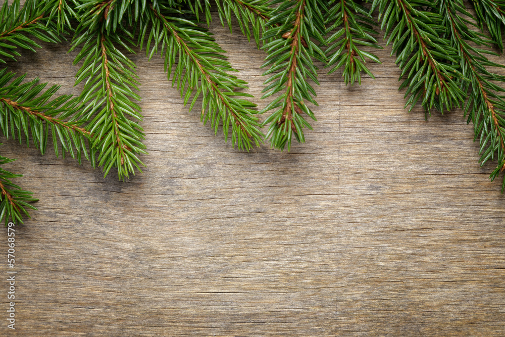christmas background from fir twigs on wooden table christmas background from fir twigs on wooden table