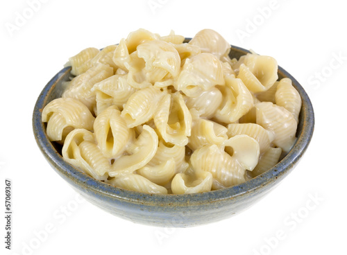 Small cheese covered pasta shells in a bowl