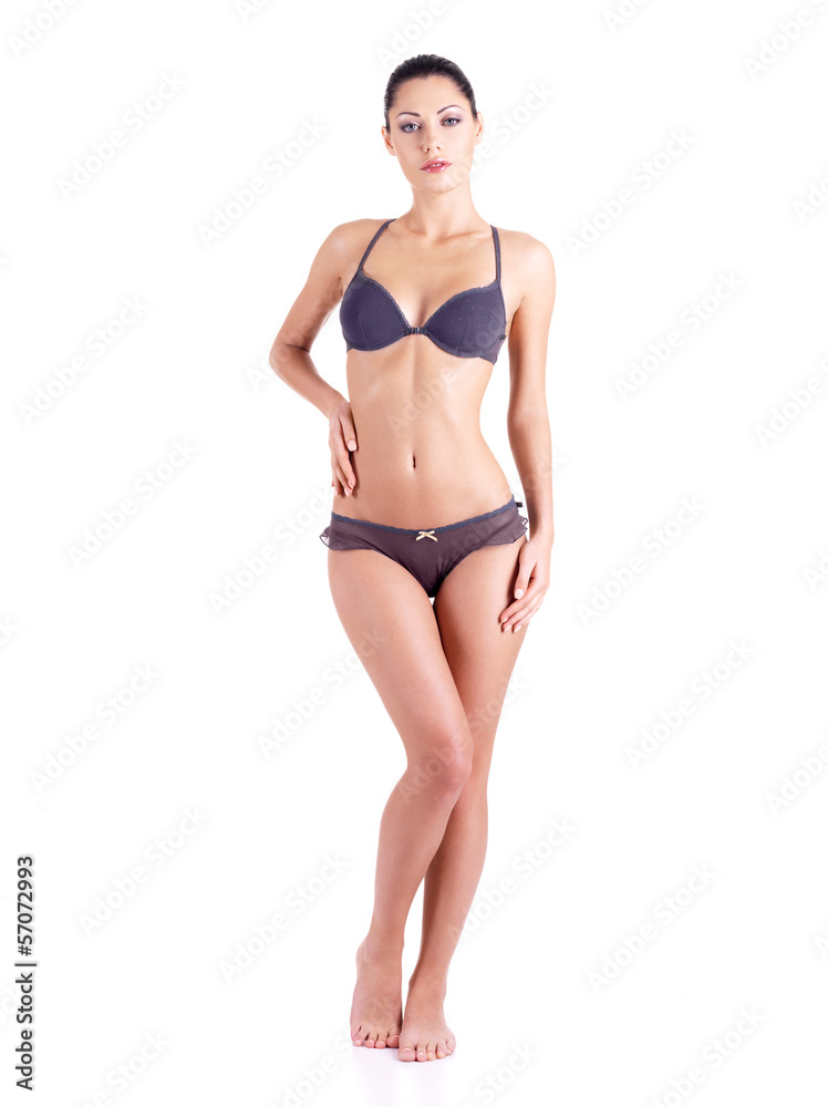 Full body of a young woman in a grey bikini Stock Photo | Adobe Stock