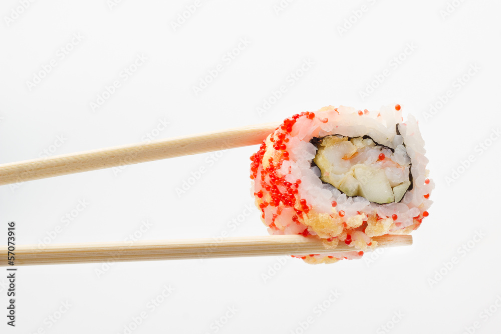 Single sushi roll in tempura and chopsticks Single sushi roll in tempura and chopsticks