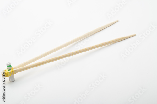 Bamboo chopsticks on white background