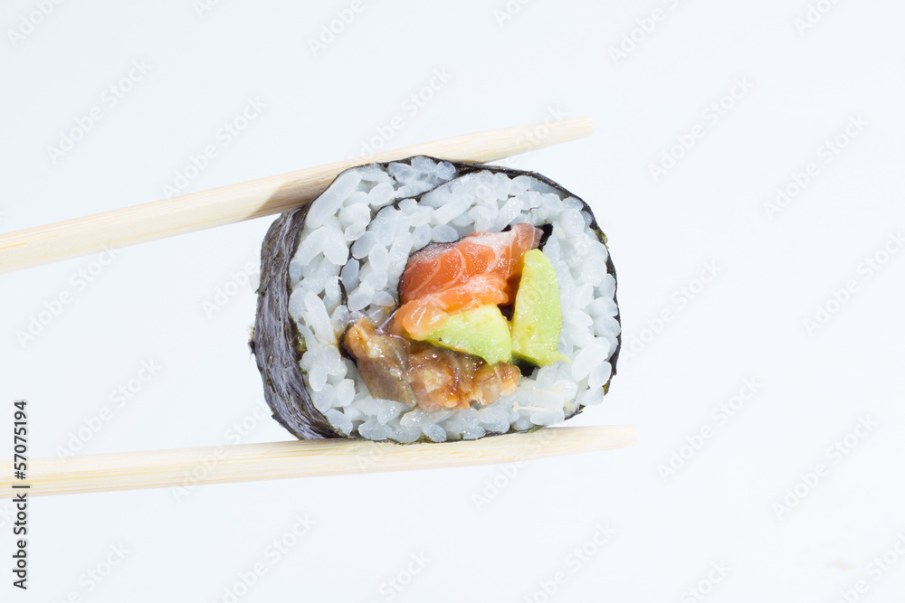 Single sushi roll in chopsticks on white background Single sushi roll in chopsticks on white background