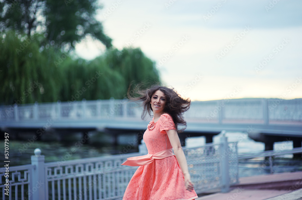 Obraz premium Portrait of beautiful girl with hair that flies in the wind
