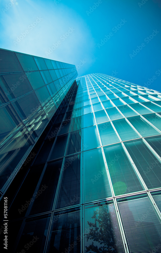 Obraz premium office buildings. Modern glass building exterior