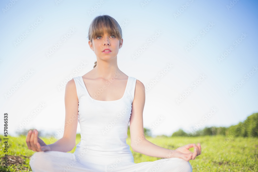 Natural young woman doing yoga