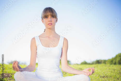 Natural young woman doing yoga