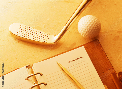 golf club and notebook