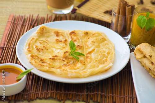 roti canai and teh tarik, very famous drink and food in malaysia