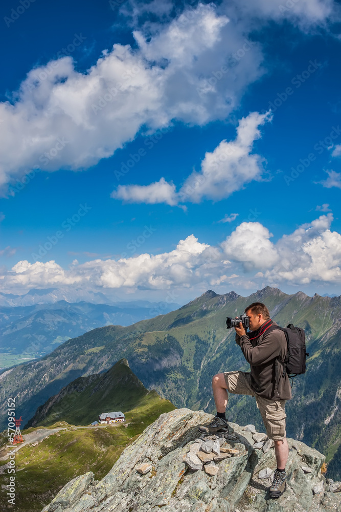Photographer takes pictures in the mountains