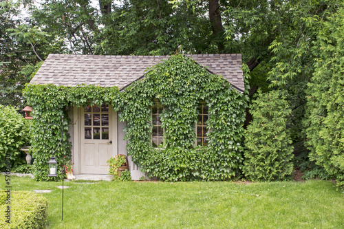 Garden house covered with vines