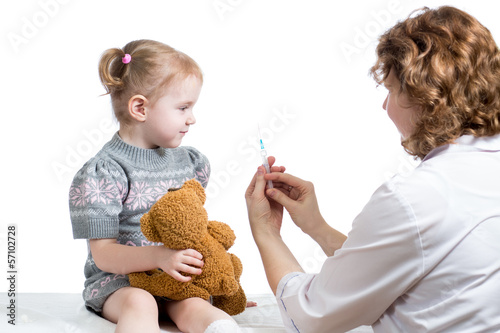 doctor vaccinating kid photo