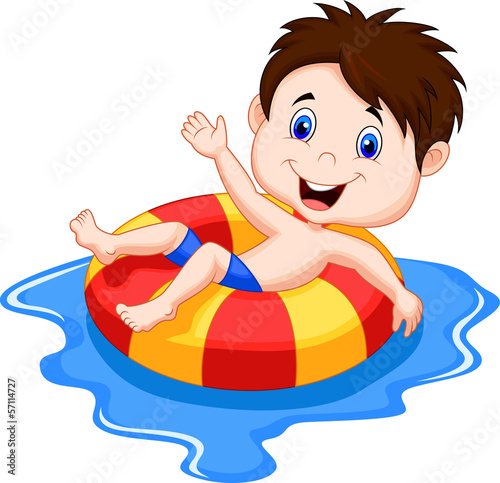 Boy floating on an inflatable circle in the pool