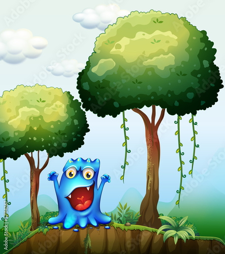 A smiling blue monster at the forest near the cliff
