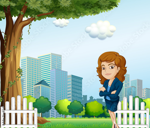A girl relaxing on her breaktime near the tree