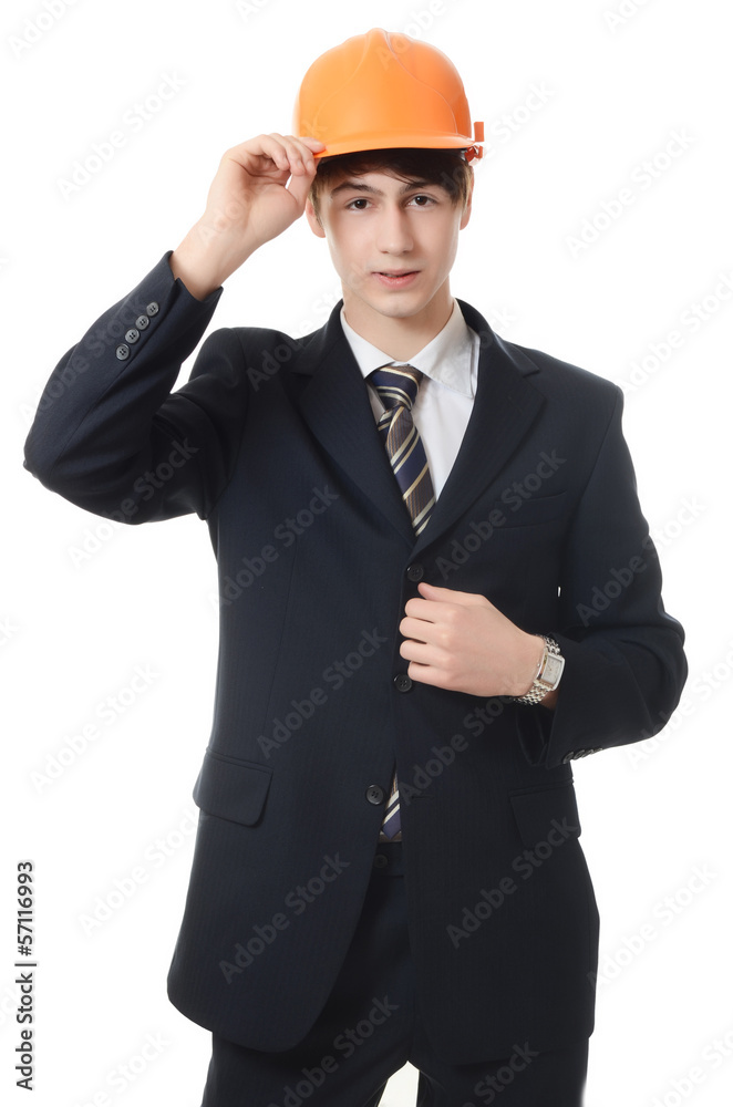 The businessman in a business suit and building helmet The businessman in a business suit and building helmet