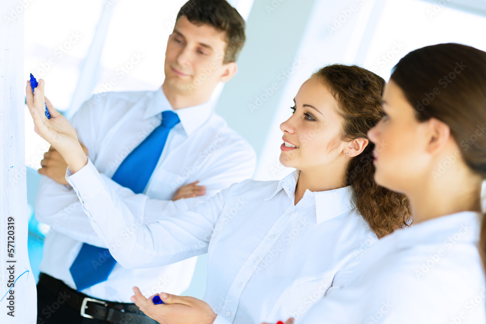 businessmen are meeting near the flipchart businessmen are meeting near the flipchart