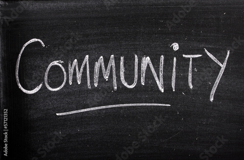 The word Community written on a blackboard photo