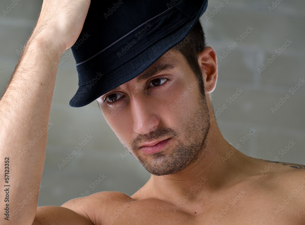 Headshot of handsome young man wearing hat Headshot of handsome young man wearing hat