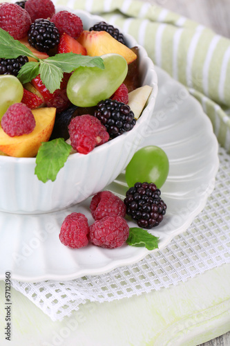 Fruit salad in bowl  on wooden background