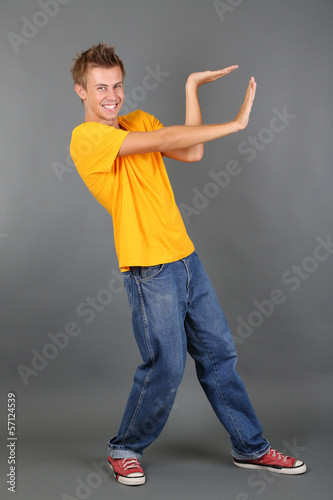 Handsome young man dancing ...