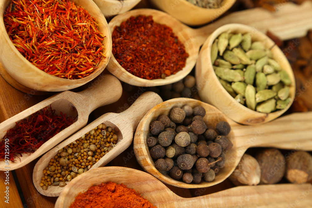 Many different spices and fragrant herbs close-up background