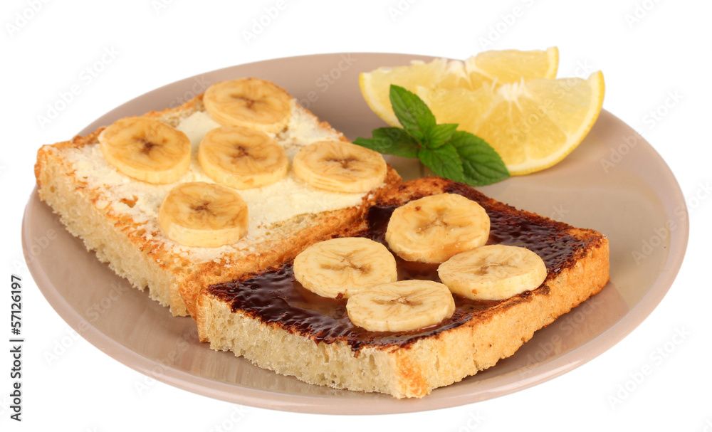 Delicious toast with bananas on plate isolated on white Delicious toast with bananas on plate isolated on white