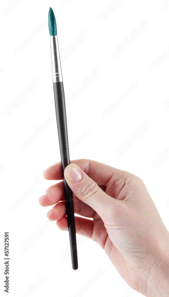 Hand holding brush with green paint isolated on white Hand holding brush with green paint isolated on white