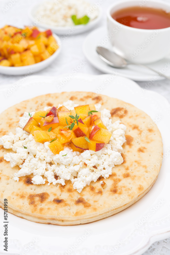 Flat bread with cottage cheese, honey, nuts, peaches