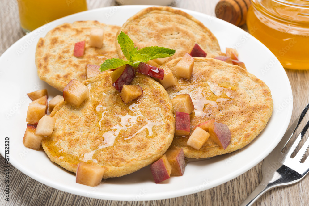 homemade pancakes with peaches and honey for breakfast