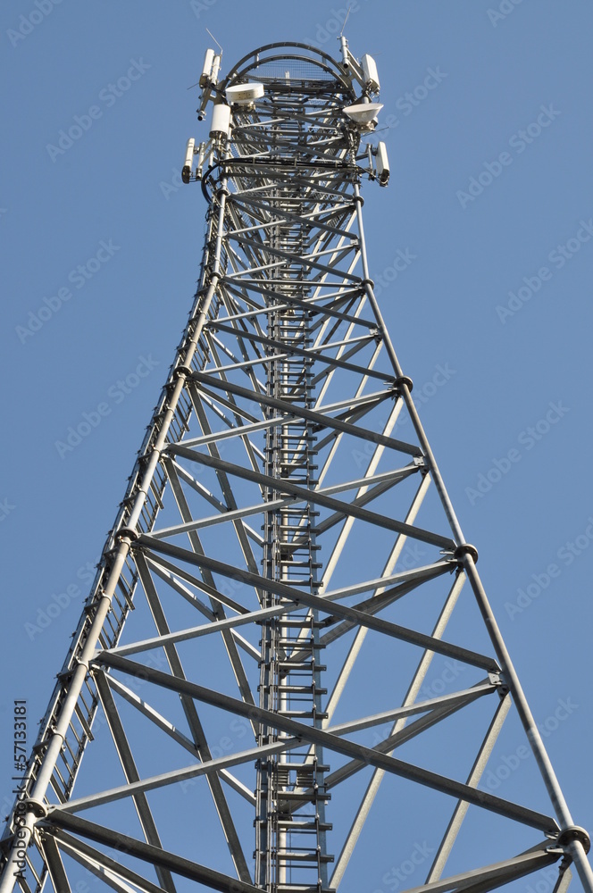 Telecommunication tower against the blue sky