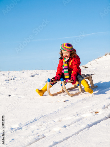 little girl sledging