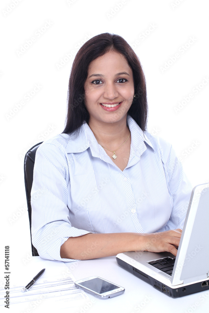 Smiling young business woman working with laptop Smiling young business woman working with laptop