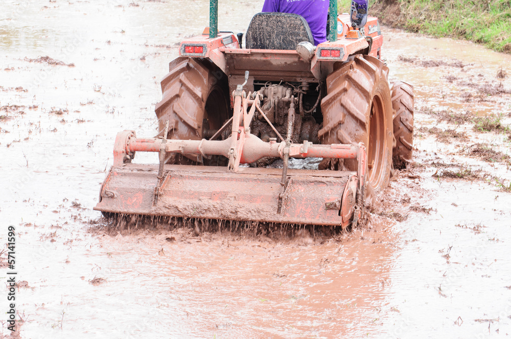 Obraz premium Tractor plowing the fields