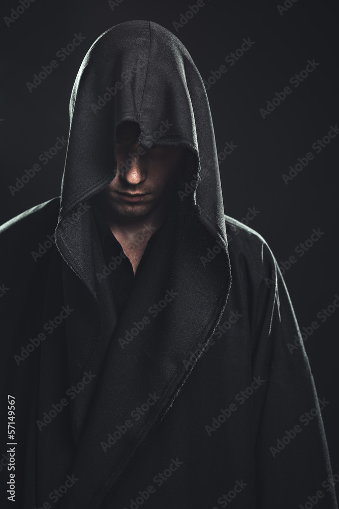 Fototapeta premium Portrait of man in a black robe