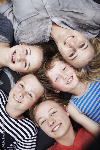 Happy family portrait of mother and four siblings