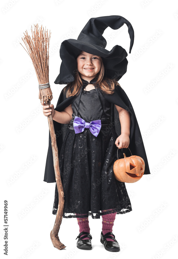 Obraz premium little witch with a broom and pumpkin