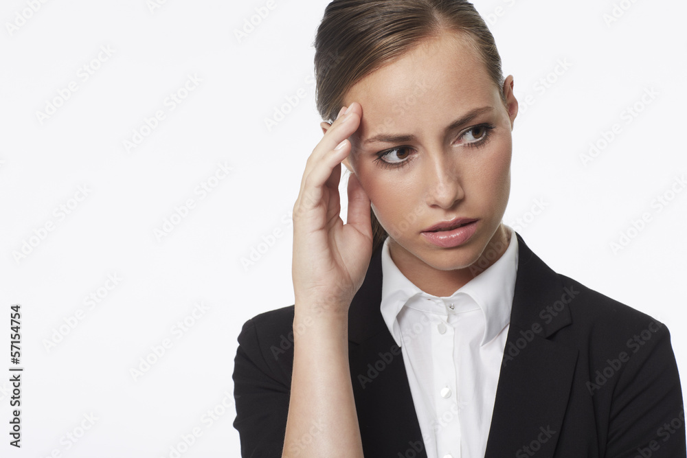 Young businesswoman looking away against white background Young businesswoman looking away against white background