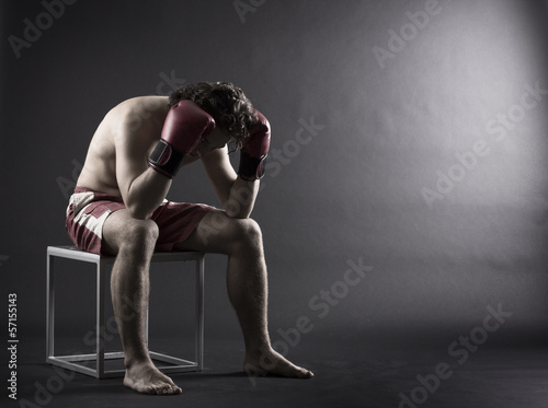 Fototapeta Naklejka Na Ścianę i Meble -  Boxer man concentrating on dark background