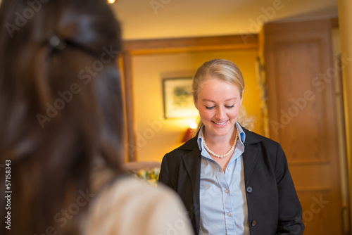 Beautiful blond hotel receptionist