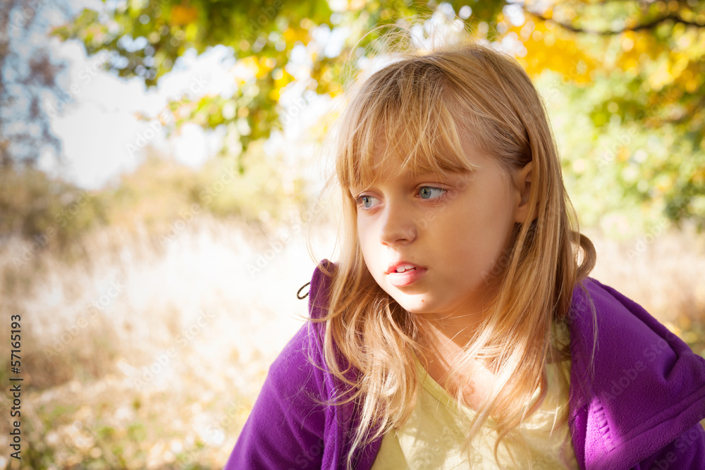 Portrait of the little blond girl in autumn park Portrait of the little blond girl in autumn park