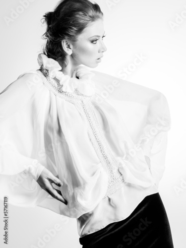 beautiful woman model in white elegant blouse posing dramatic