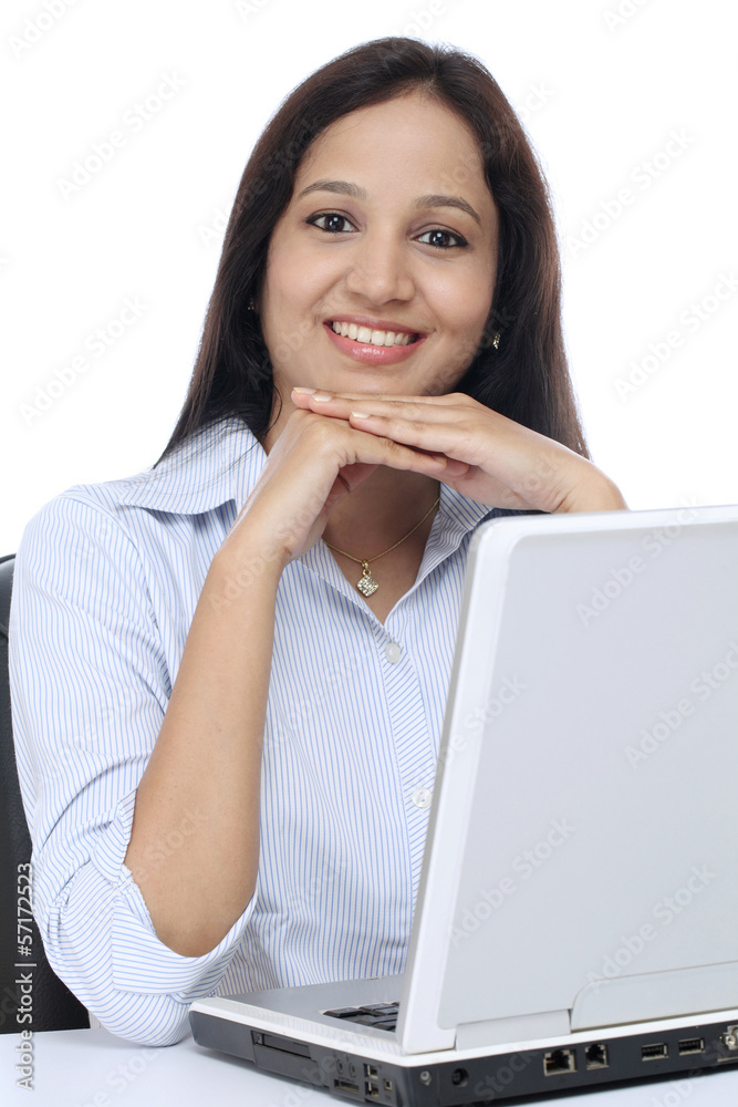 Smiling young business woman working with laptop Smiling young business woman working with laptop
